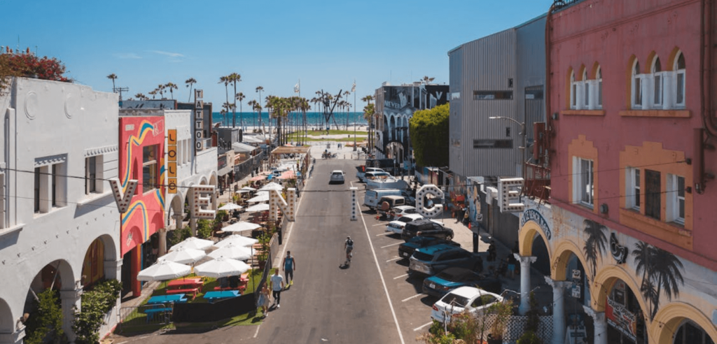 Best places to visit in Los Angeles: The iconic Venice Beach boardwalk with palm trees and a relaxed coastal vibe