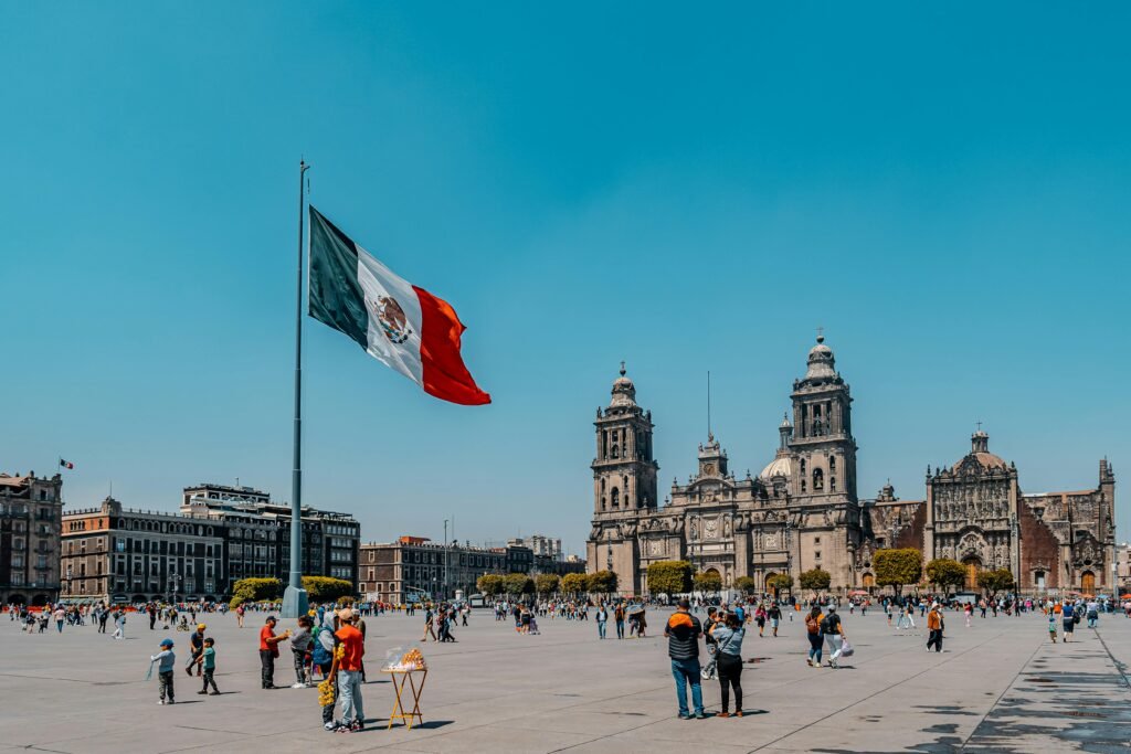 Mexico City’s Plaza de la Constitución (Zócalo) with the towering Mexican flag and the historic Mexico City Metropolitan Cathedral — a must-see for things to do in Mexico City. Captured on Sony A7R V, 16mm, f/8.
